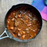 A soup pot filled with beef stew